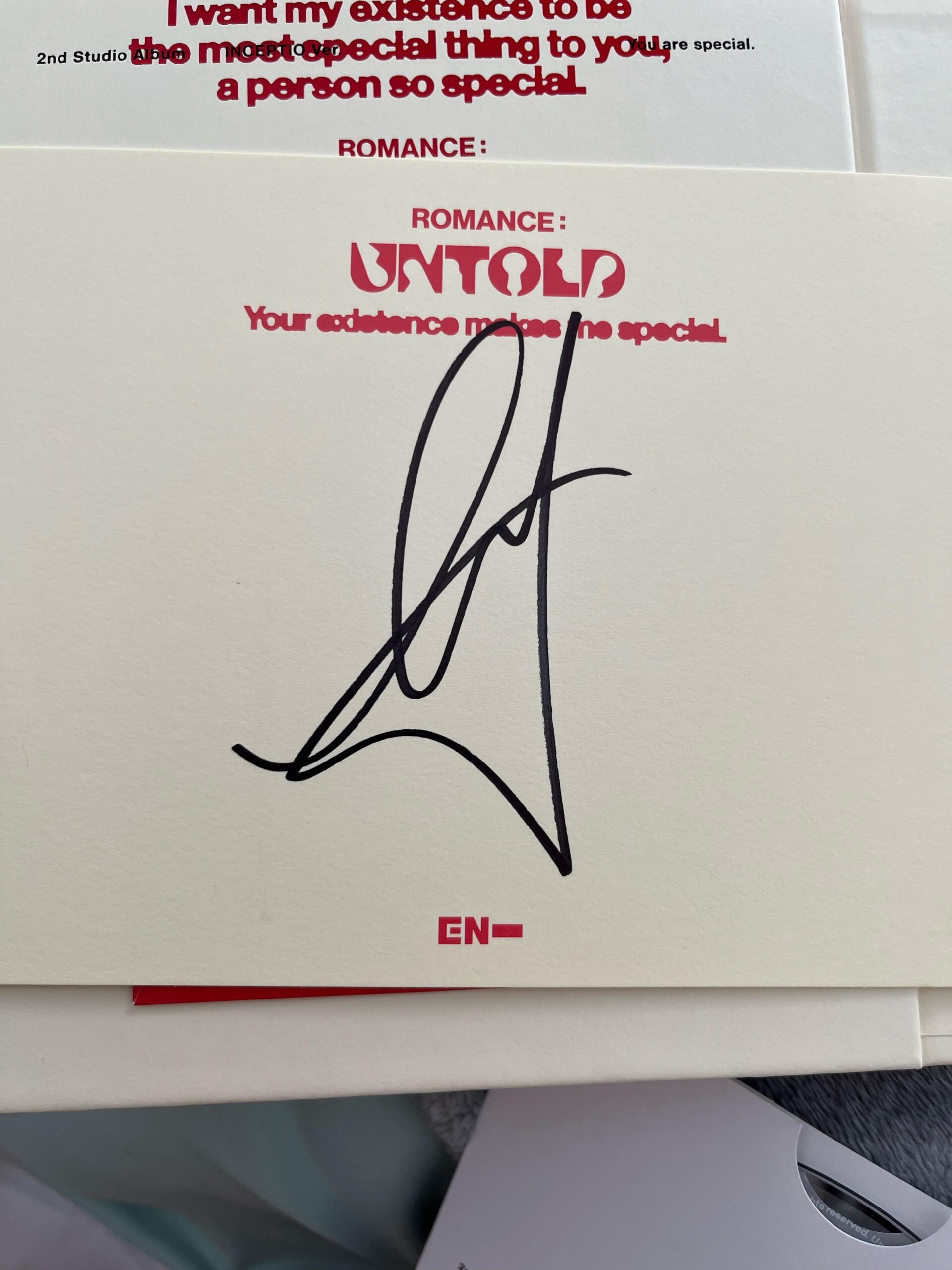 Which member’s signature is this?